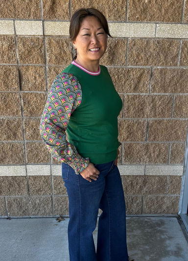 Green sweater with contrast sleeves